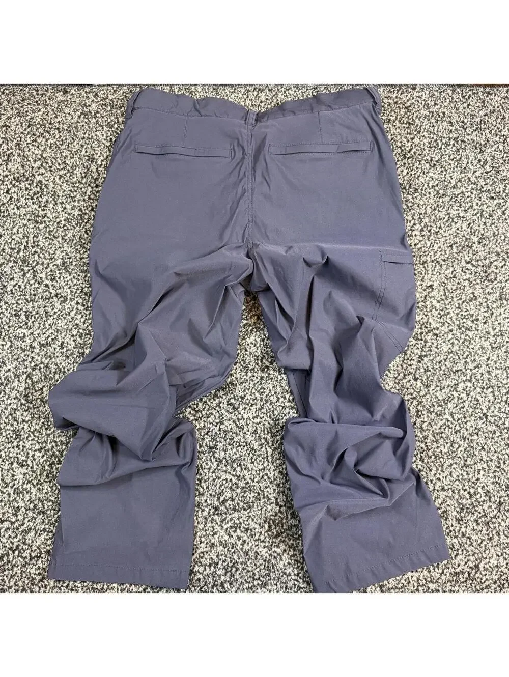 Navy blue cargo pants with adjustable waist, size 34x30